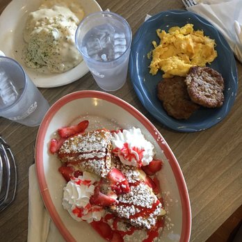 Henhouse Cafe - Strawberry cheesecake French toast with sides of sausage, scrambled eggs, biscuit and gravy - Cafes Near Me - Gilbert, Arizona