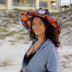 Tiki Island Wear - We created custom straw hats for the Orange Bowl, blending vibrant branding with sun protection to showcase the event's iconic spirit.