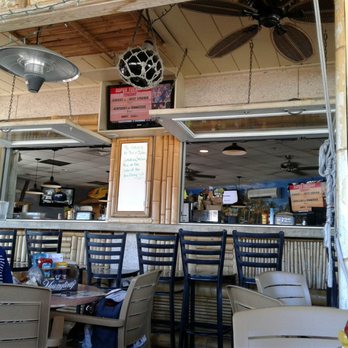 Hurricane Grill & Wings - Outdoor covered seating by the bar. - Chicken Wings Near Me - Saint Augustine, Florida