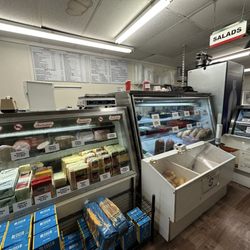 Giovanni's Delicatessen - Deli counter with menu on wall in background