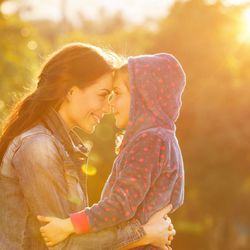 Behavioral Innovations - woman with child smiling