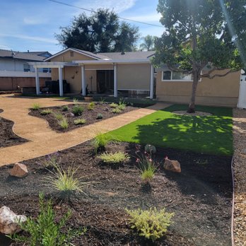Growscapes - Walkways, artificial turf, rocks and a seating area for a firepit. Lots of drought tolerant plants and landscape rocks! - Landscaping Near Me Growscapes - Walkways, artificial turf, rocks and a seating area for a firepit. Lots of drought tolerant plants and landscape rocks! - Landscaping Near Me