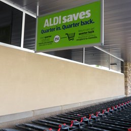 To use a shopping cart, insert a quarter to remove it from the storage area.  You can receive your quarter back after you return the cart.