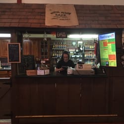 Fire Escape Coffee House - Working the register.