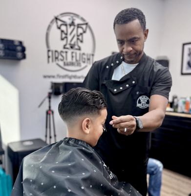 Looking good today sets you up for a beautiful tomorrow! - Welcome to First Flight Barber & Styling, Charlottes premier barber salon! We offer the best haircut, facial, and hair treatment services for men, women, and children. Our goal is to make you look and feel your absolute best, and we’ll have a fantastic time doing it. Come visit us, we guarantee you won’t regret it! Looking good today sets you up for a beautiful tomorrow! - Welcome to First Flight Barber & Styling, Charlottes premier barber salon! We offer the best haircut, facial, and hair treatment services for men, women, and children. Our goal is to make you look and feel your absolute best, and we’ll have a fantastic time doing it. Come visit us, we guarantee you won’t regret it!