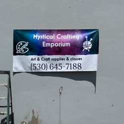 We are located in the entrance around the corner, behind this sign