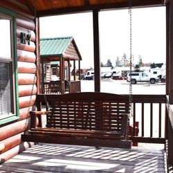 Flathead Harbor Resort RV, Luxury Condos & Cabins - Porch swing on the cabins