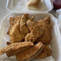 Indi's Fast Food Restaurant - This is a 4-piece chicken box with a mix of the spicy and regular flavors with 2 each and side of potato wedges.