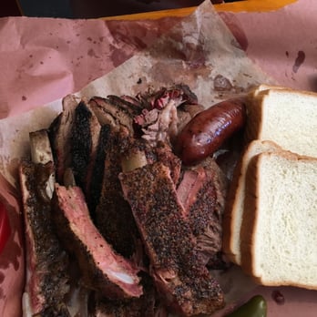 Franklin Barbecue - Pork Ribs on top of Brisket with a Beef Sausage Link. - Barbeque Near Me - Austin, Texas