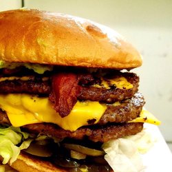 Grill-A-Burger - Ruff Neck Burger: Triple meat, triple cheese, all the way with bacon, guacamole, grilled onions and jalapeños!