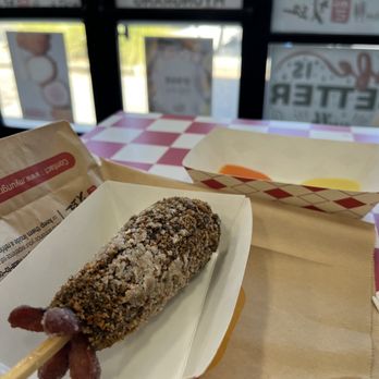Myungrang Hotdog - 5. Squid-ink with Sausage and Mozzarella Cheese and cheese mustard sauces in the background - Korean Near Me - Palmdale, California Myungrang Hotdog - 5. Squid-ink with Sausage and Mozzarella Cheese and cheese mustard sauces in the background - Korean Near Me - Palmdale, California