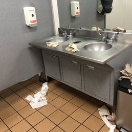 The restroom was dirty trash was overflowing The restroom was dirty trash was overflowing