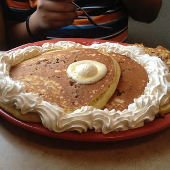 Scramblers - Scrambler Marie Stack-3pancakes w/added toppings of whipped cream and almonds. Yummy! - Breakfast & Brunch Near Me - Reynoldsburg, Ohio