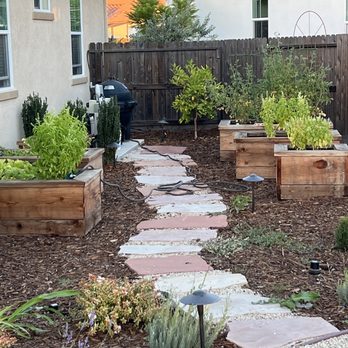 Geremia Pools & Landscaping - Our stone walkway to the redwood planter's that we use for herbs, vegetables and fruits! - Landscaping Near Me - Sacramento, California