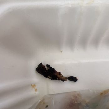 The Corner Pub - Piece of burnt chicken. - Pubs Near Me - Decatur, Georgia