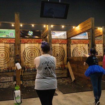 Unleashed Camden - a group of people playing a game of darts - Axe Throwing Near Me - Kingsland, Georgia Unleashed Camden - a group of people playing a game of darts - Axe Throwing Near Me - Kingsland, Georgia