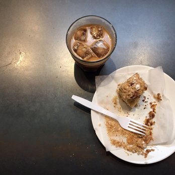 Cartel Roasting - Small iced mocha in a glass, with coffee cake, stuffed with pecans, cinnamon sugar, and raisins. - Coffee & Tea Near Me - Tucson, Arizona Cartel Roasting - Small iced mocha in a glass, with coffee cake, stuffed with pecans, cinnamon sugar, and raisins. - Coffee & Tea Near Me - Tucson, Arizona