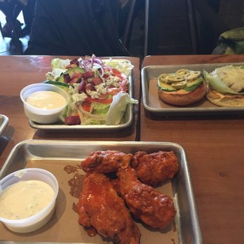 Renegade's Pub - Chopped salad, Ladder 21 burger, wings, all served on metal trays. - Pubs Near Me - Boston, Massachusetts Renegade's Pub - Chopped salad, Ladder 21 burger, wings, all served on metal trays. - Pubs Near Me - Boston, Massachusetts