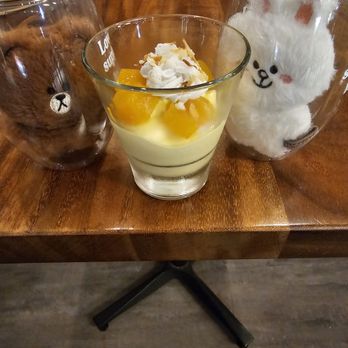 Threadfin Bistro - Dessert: tropical mousse with mango puree-lilikoi mouse, toasted coconut flakes, and adorned with passion fruit gel... excellent!!! - Seafood Near Me - Honolulu, Hawaii