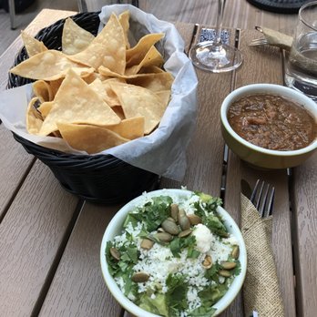 Cósmica - Chips and guacamole with complementary salsa! Would recommend the guac- I loved the pumpkin seeds and cheese - Mexican Near Me - Boston, Massachusetts