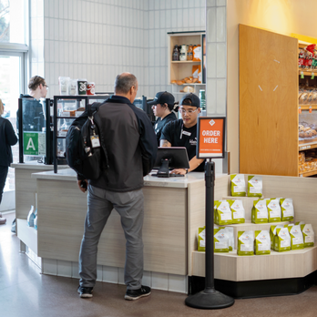 Klatch Coffee - Barista at cash-wrap assisting customer. - Coffee & Tea Near Me - Diamond Bar, California