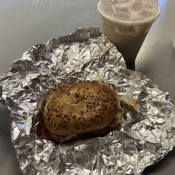 Crema - Breakfast Rueben on everything bagel to-go, Iced chai latte with whole milk - Coffee & Tea Near Me - Raleigh, North Carolina