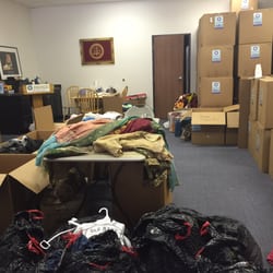 Helping Hands - Sorting through the clothes to send to Countries in need. May God reward them for the amazing work they do.