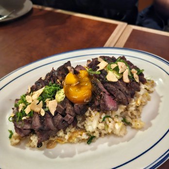 Manhatto - Ribeye Fried Rice- USDA prime ribeye, miso compound butter, marinated egg yolk, rice. $49. Excellent rice, but I wish the steak was better - Japanese Near Me - New York, New York Manhatto - Ribeye Fried Rice- USDA prime ribeye, miso compound butter, marinated egg yolk, rice. $49. Excellent rice, but I wish the steak was better - Japanese Near Me - New York, New York