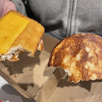 McDonald's - a person holding a half eaten sandwich - Fast Food Near Me - Daytona Beach, Florida McDonald's - a person holding a half eaten sandwich - Fast Food Near Me - Daytona Beach, Florida