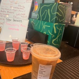 a cup of iced coffee on a table