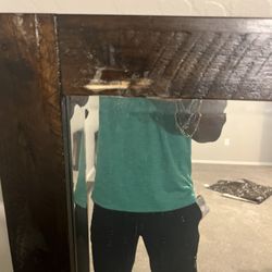 Picture of the same dresser mirror with damage (Scrape) done to the upper left hand corner.