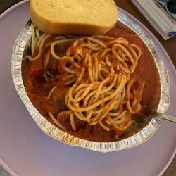 Broadway Pizza - Spaghetti and meatballs with a side of garlic bread.