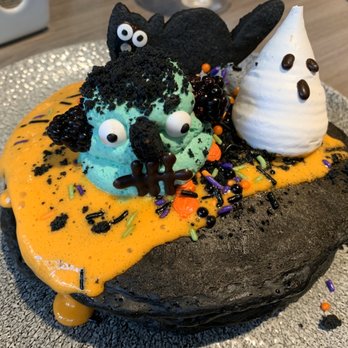 Basalt - Spooky Halloween pancakes: Lilikoi Sabayon, meringue ghost, shortbread kitty, Frankenstein whipped cream, & candy sprinkles. - New American Near Me - Honolulu, Hawaii