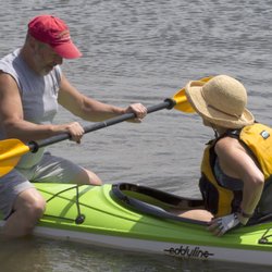 Evergreen Outfitters - John, one of our many volunteer instructors, helping a new paddler try out an Eddyline Skylark.