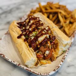 Kooky Canuck - Big Beautiful Que - pulled pork, kielbasa, coleslaw, bbq sauce and rub on French bread and served with French fries.