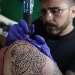 Powerhouse Tattoo - Renan laying down some clean linework