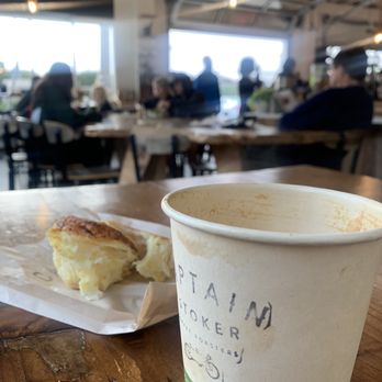 Captain + Stoker - Latte and bread with background view - Coffee Roasteries Near Me - Monterey, California