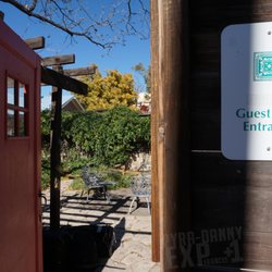 Alpine Guest Lodging - From the alley, you open the orange door and BAM!- Now you're in the courtyard where the rooms are.