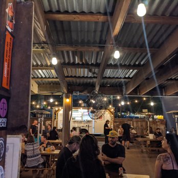 Latchkey - Back patio and food truck. There's a bar inside and on the patio. - Dive Bars Near Me - Austin, Texas
