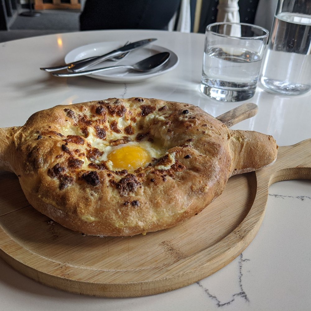 Dediko - Ajaruli kachapuri (baked egg cheese bread with butter) - Georgian Near Me - Vancouver, Washington