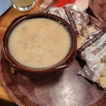 Hooters - a bowl of soup and bread on a plate - Sports Bars Near Me - Melrose Park, Illinois