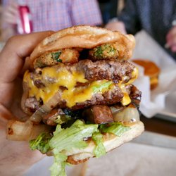 The Burger's Priest - Jacob’s Deception: Premium beef patty, American cheddar, grilled onions, mushrooms, shredded lettuce, tomato, smoke (deep fried jalapeños),