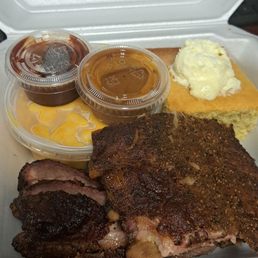 Macc & Cheese, corn bread, ribs and brisket. Spicy bbq sauce & carolina Sauce.