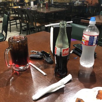El Salvador Restaurant - Coke brought to me and dropped to the table as if I was an animal in a cage getting fed. - Salvadoran Near Me - Irving, Texas