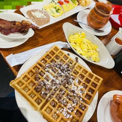 La Casa De Frida - Ahhh!  Deliciousness all around! Bacon &Cheese Omelette with avocado, Chocolate Chips Waffles w/eggs & bacon.