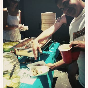 Kut N' Sow - man serving food - Food Stands Near Me Kut N' Sow - man serving food - Food Stands Near Me