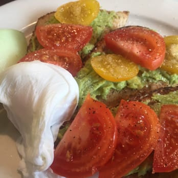 Dog Lane Cafe - One of today's breakfast specials - Avocado Toasts with a poached egg and honeydew melon - Breakfast & Brunch Near Me - Storrs, Connecticut