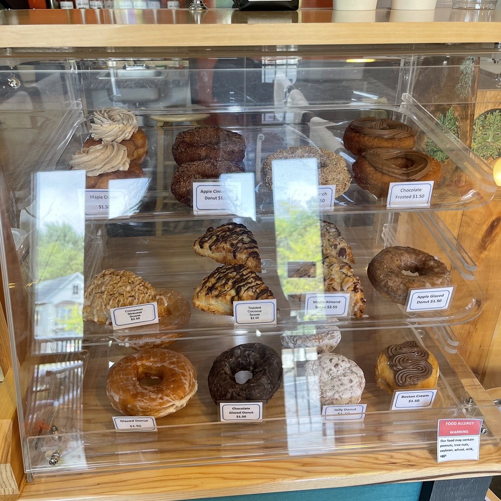 Maine Coast Roast - a variety of donuts in a display case - Coffee Roasteries Near Me - Biddeford, Maine