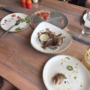 Monkeypod Kitchen - Sorry for the lack of dishes we ate them all.  Leftover of marg pizza and garlic truffle fries. - Tacos Near Me - Honolulu, Hawaii