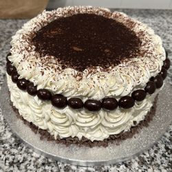 Carol's Cupcakery - Chocolate Espresso two-layer cake, vanilla buttercream, topped with cocoa, decorated with chocolate espresso beans and shaved chocolate